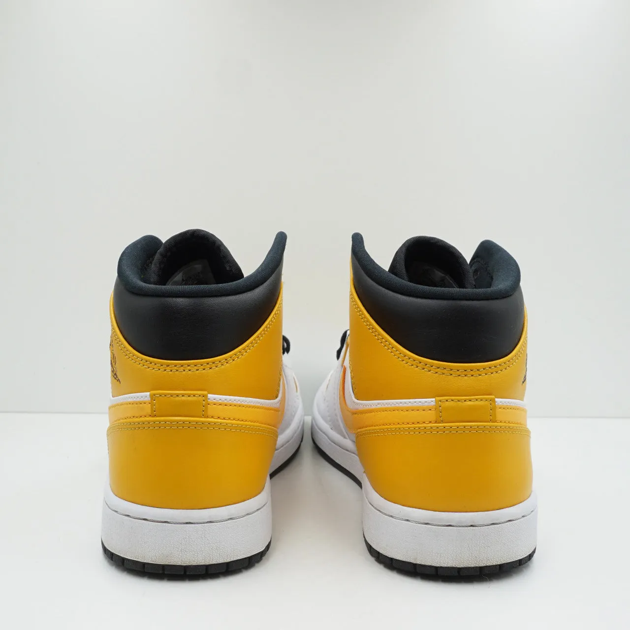 Jordan 1 Mid University Gold