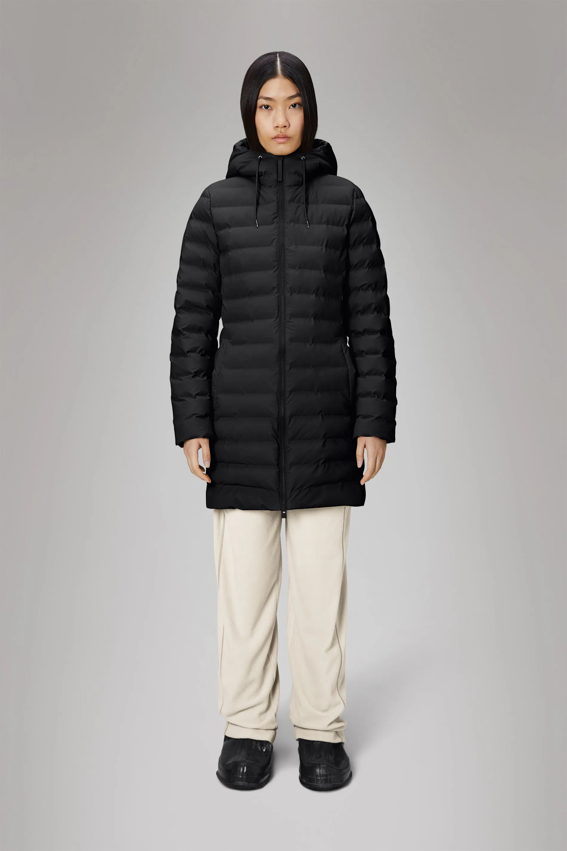 Rains® Lohja Long Puffer Curve Jacket in Black for €299 | 2-Year Warranty