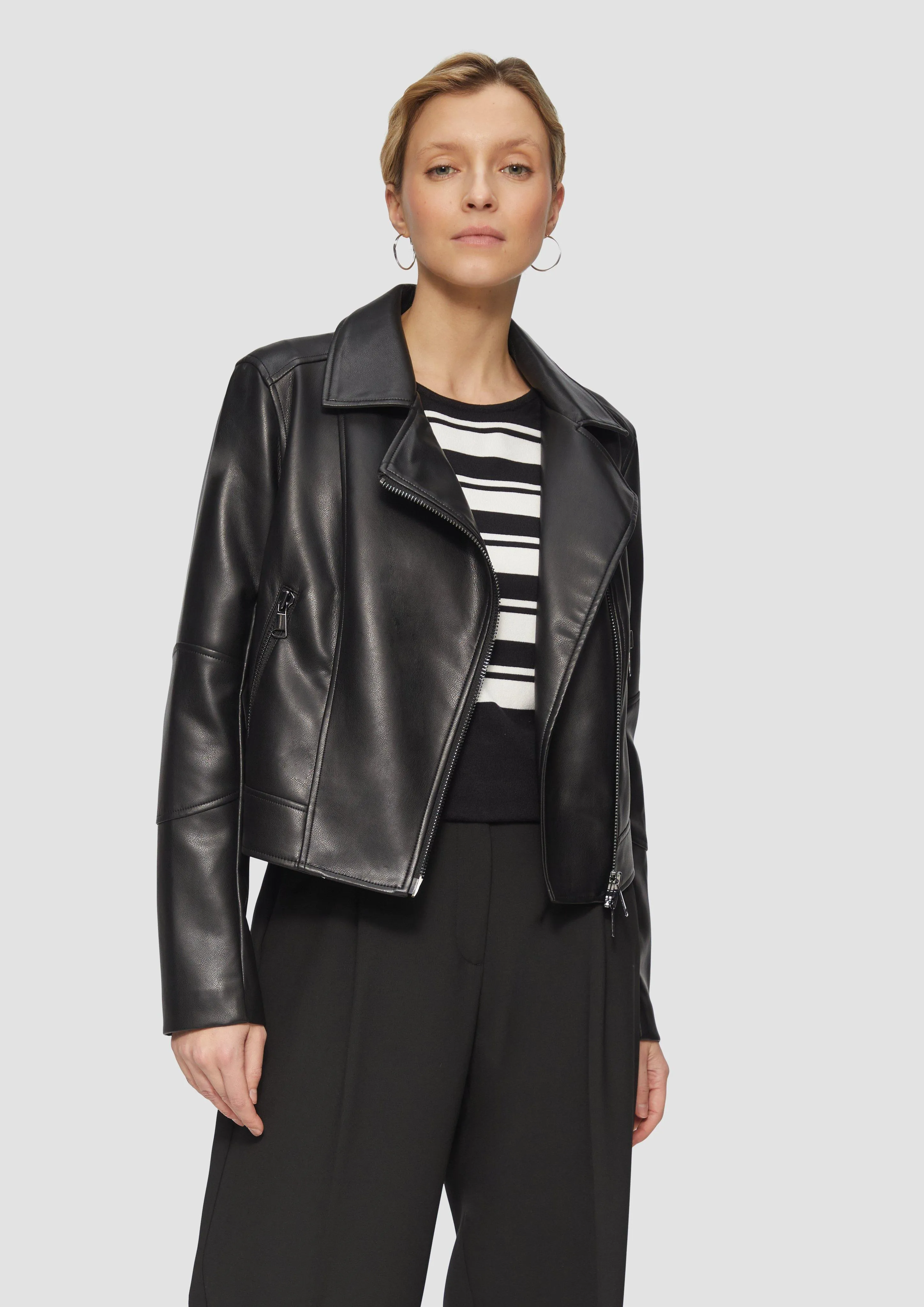 Slim-fitting faux leather jacket with a lapel collar